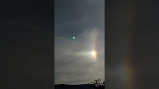 Signs in the sky:Arc exiting sun dog on parhelic circle in aerosol saturated stratosphere. SD,CA