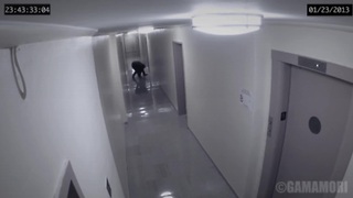 Security Camera Captures A Strange Figure Attacking A Man In A Hallway