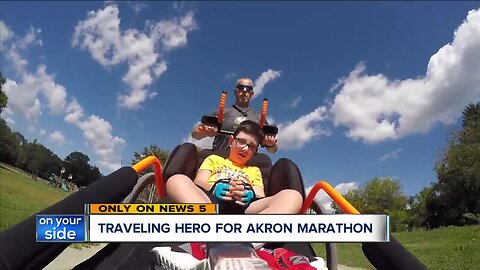 Donated racing chair allows father and son to run Akron Marathon together