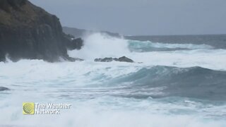 Waves crash on the rocks at Middle Cove