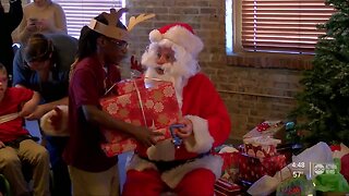 Santa visits visually impaired students in Tampa, hands out gifts