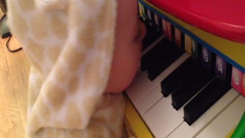 "Baby Learning To Play Piano"