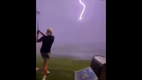 Lightening Strikes A Golf Ball Feet From Golfer