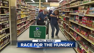Two businesses provide a shopping spree for their local food bank