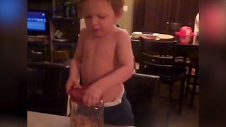 Funny Little Boy Loves Eating Nuts