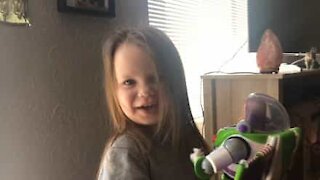 Little girl super happy with Buzz Lightyear toy
