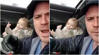 Father and 2-year-old daughter rave it up in car