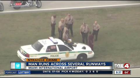 Officials: Man jumps fence at Miami airport