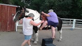 Woman Tries To Get Off A Horse