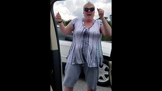 Woman Stuck In Traffic Jam Dances On Highway