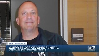 Surprise cop, accused of crashing a funeral, remains on the job