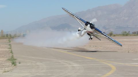 Stunt plane pulls off flawless low pass