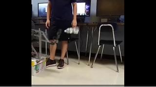 High school students build robot that perfectly flips water bottle