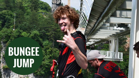 Thrillseeker takes leap of faith as he jumps off the world's tallest footbridge.