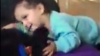 Cute Little Girl and Dog Playing