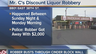 Thief breaks through liquor store wall