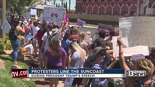 Protesters rally outside the Suncoast as President Trump arrives in Las Vegas