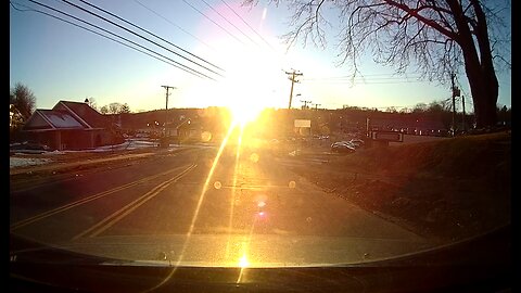 Blinding sun glare hides pedestrian on road