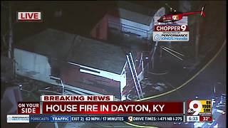 Firefighters say a man drags neighbor out of burning house in Dayton, Ky.