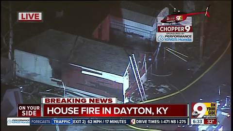 Firefighters say a man drags neighbor out of burning house in Dayton, Ky.