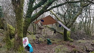 removing guylines from the DD hammocks 3x3 tarp. Reddacleave campsite. Dartmoor 26th March 2023