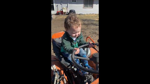 Boy and his tractor!