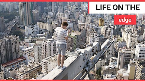 Dizzying birds-eye view of the skyline of Hong Kong taken by one daredevil drone-pilot