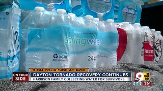 Harrison Family collects water for Dayton