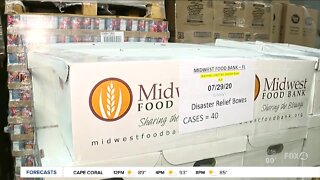 Busy distribution day at Midwest Food Bank warehouse in Fort Myers