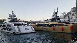 Matte Black Lamborghini Urus and massive yacht "parking" next to a Palmer Johnson 48M Supersports
