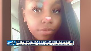 Mother killed in crossfire with kids in the car