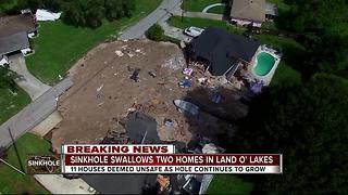 Sinkhole swallows 2 homes, continues to grow in Land O' Lakes