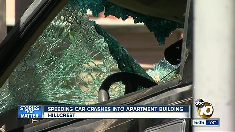 Speeding car crashes into apartment building