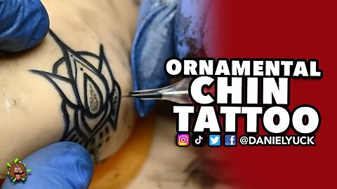 Ornamental Chin Tattoo