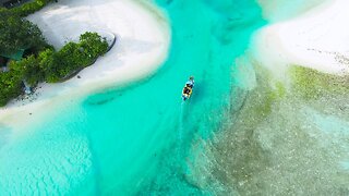 A banana boat in a wonderful landscape with clear and blue water code