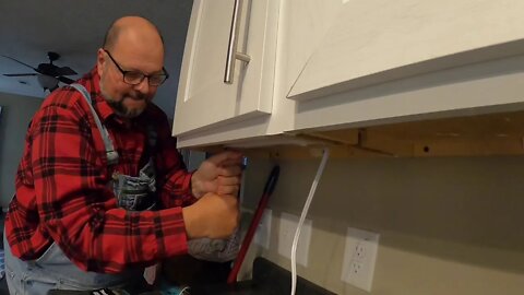 Installing under cabinet lights that I got from Lowes