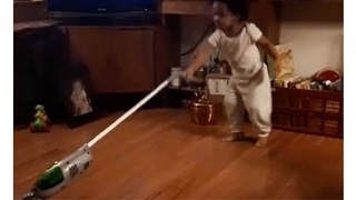Watch this Adorable toddler dance up a storm while vacuuming for mom