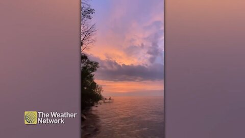 Listen to the calming waves of Lake Simcoe during a pink sunrise