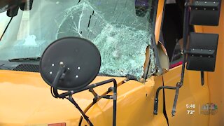 Power lines knocked down by high winds damage school bus