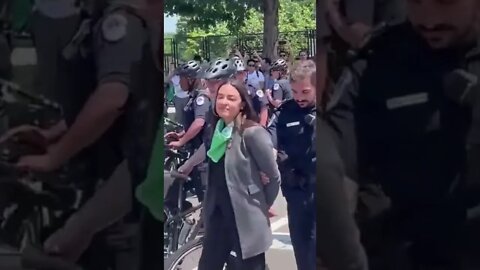 ‘Queen of Propaganda’ - AOC Pretends To Get Arrested With Imaginary Handcuffs