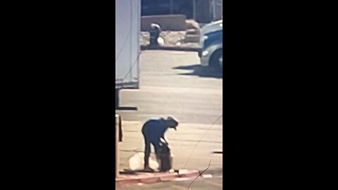 Guy looking for crack in truck stop parking lot