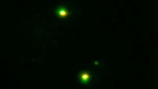 UFO through night vision, two objects synchronous flight