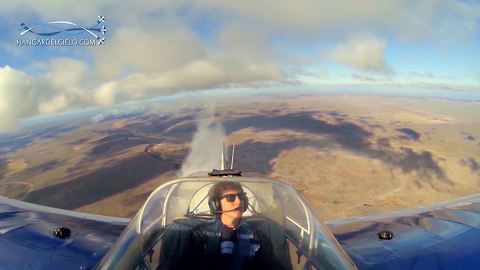 Multiple camera angles capture stunt plane's flawless flat spin