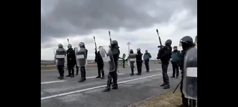 Spanish police shooting rubber bullets at farmers protesting...