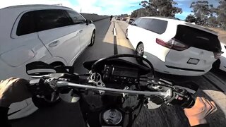 Dual camera action riding Suzuki drz400s on the freeway.