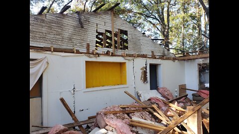 Old Man Salvages old House Roof Rafters .