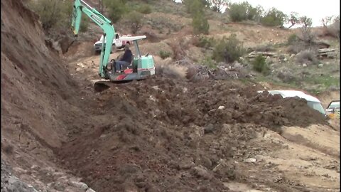 Yanmar YB451 Excavator Repairing The Lower End Of The Switchback Trail