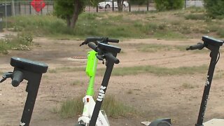 Vigilante scratching out QR codes on illegally parked scooters around Denver