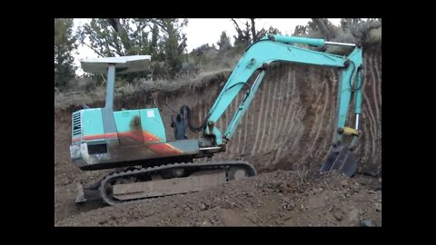 Yanmar YB 451 Excavator Digging on a Berm