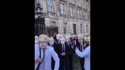 Hundreds Of Masked Boris Johnsons Protest Outside Downing Street